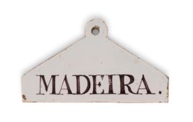 A delftware bin label, c.1770-80, of coathanger form with a circular suspension ring, painted in man