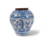 A large North European tin-glazed storage jar, 17th century, decorated with clusters of houses amids