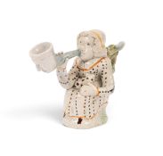 A Pratt ware Toby jug pipe of Martha Gunn, c.1800, seated and wearing a polka dot dress, a recumbent