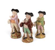 Three Hearty Good Fellow Toby jugs, c.1810-25, each standing in dynamic pose and holding a jug of al