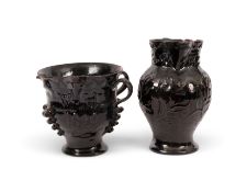 Two unusual black-glazed pottery jugs attributed to Buckley Pottery, dated 1820, one of squat form a