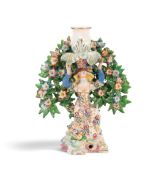 A Bow candlestick figure of a Levantine lady, c.1765, kneeling on one knee and raising her arms to s