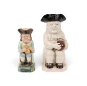 Two Toby jugs, c.1790-1800, the larger of Ordinary type with an empty jug of ale, left in the white 