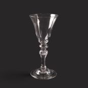 A large baluster wine glass or goblet, c.1750, the generous bowl raised on a shoulder knop above a b
