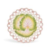 A Derby 'spectacle' dish, c.1760, the well moulded with three overlapping leaves, the reticulated ri