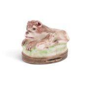 A rare silver-mounted St Cloud snuff box in the form of a lion, c.1730, recumbent on a grassy oval b
