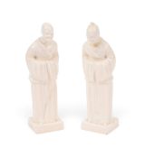 A pair of rare and unrecorded English porcelain figures of Chinese monks, c.1800, each standing and 