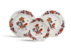 A pair of Chinese Imari chargers, Qianlong 1736-95, boldly painted with flowering plants with a smal