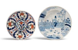 A Bristol delftware plate, c.1720, of pancake shape, painted in blue, red and green with a central t