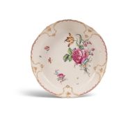 A large Tournai shallow bowl (compotier), c.1763-74, the dished form finely painted with a flower sp