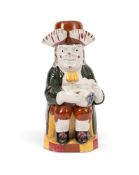 A Yorkshire pearlware Toby jug and stopper, c.1800, wearing a dark green coat with claret buttons, t