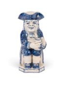 A rare blue and white Toby jug, c.1800-20, of Ordinary type, his empty jug of ale painted with a Chi