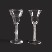 Two large wine glasses, c.1760, one with a squat bell bowl raised on a mixed stem with a double seri