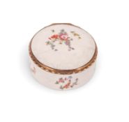 A London enamel circular snuff box, c.1760-70, delicately painted with sprays of European flowers wi