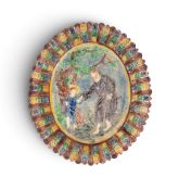 A Palissy type maiolica oval dish, probably 19th century, modelled in high relief with Jesus as a ch