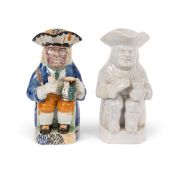 A Mexborough (Yorkshire) Purple Face Toby jug, early 19th century, a Toby jug resting on his left kn