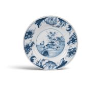 A rare Glasgow 'Delftfield' delftware plate, c.1760, painted in blue with a boat at sail before a sm