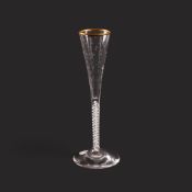 A ratafia glass, c.1800, the slender flute moulded to the lower section and engraved with stars, rai