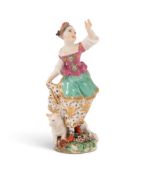 A Chelsea figure of a dancing shepherdess, c.1760, holding the edge of her skirt in her right hand, 