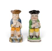 Two small Toby jugs, c.1800-10, one Pratt ware and raised on a tall base sponged in blue and ochre, 