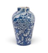 A rare Dublin or Liverpool delftware vase, c.1760, the ovoid form boldly painted in blue relief with