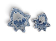 Two Continental tin-glazed pickle dishes, in two sizes, of deep leaf form, each painted with a pagod