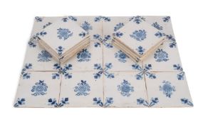 Twenty three English delftware tiles, c.1760-80, probably Liverpool, painted in blue with a central 