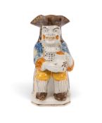 A good Pratt ware Toby jug, c.1800, of Ordinary type, his large jug of ale decorated with a barley s