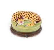 A Birmingham or South Staffordshire bonbonnière in the form of a leopard, c.1760-70, curled up on an