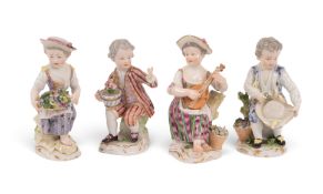 Four Meissen figures of children, mid 18th century, seated with baskets of flowers, a hat and a lute