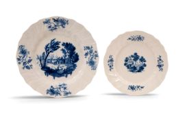 Two early Tournai blue and white plates, c.1755-60, one of large size and painted in the Delft manne