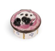 An English enamel snuff box or bonbonnière, c.1770-90, the circular form moulded and painted with a 