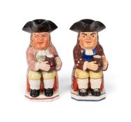 Two 'Ordinary' type Toby jugs, c.1800-20, one holding an empty jug, the other a foaming jug of ale a