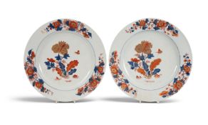 A pair of Chinese Imari chargers, Qianlong 1736-95, the wells painted with a butterfly above floweri