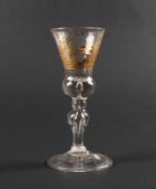 A rare Dutch-engraved light baluster glass, c.1750, the bell-shaped bowl with a solid teared base, e