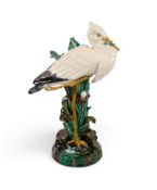 A Joseph Holdcroft Majolica stick stand, c.1880, modelled as a heron standing on one leg among bulru