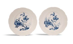 A rare pair of Tournai plates, c.1750-60, each painted in blue after a Chinese original with a styli