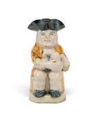 A Wood type pearlware 'Ordinary' Toby jug, c.1790-1800, his foaming jug of ale overflowing, decorate
