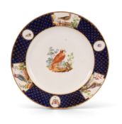 A Derby plate, c.1810-20, copying the Tournai service for the duc d'Orleans, painted with songbirds 