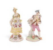 A matched pair of dry-edge Derby figures of a Scottish musician and companion, c.1755-56, he wearing