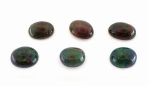 Lot 6 lose schwarze Opale, zus. ca. 20.71 ct, ovale
