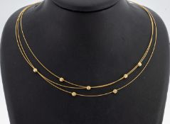 18 kt Gold Brillant-Collier, GG 750/000, 3-rhg., 7 einzeln