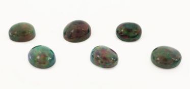 6 lose Schwarzopale, 27.82 ct, ovale Cabochonsin versch.