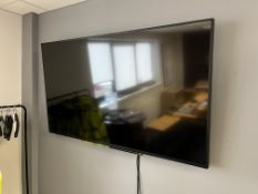65" Wall-mounted TV