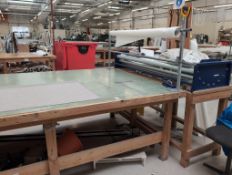 Manual Fabric Roller Complete with 10m Wooden Cutting Table . Asset No. BEL 331