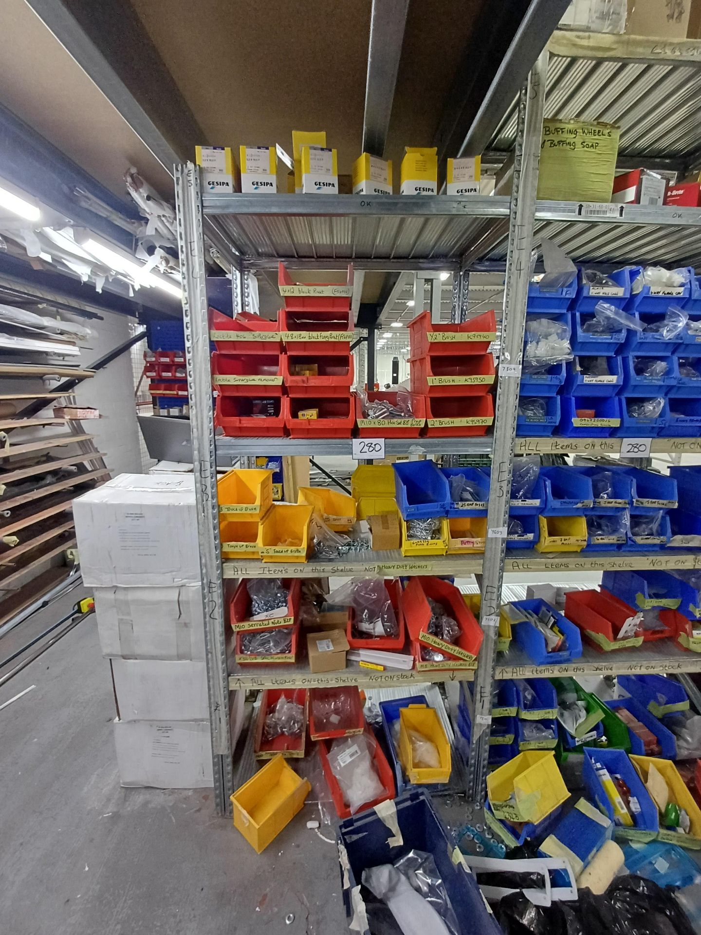 5, Bays of shelving to include contents consisting assorted fixings, drills, electrical spares and