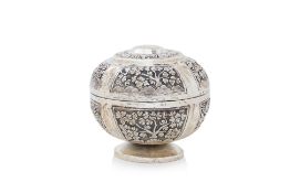 AN ORIENTAL CIRCULAR SILVER PEDESTAL BOX AND COVER
