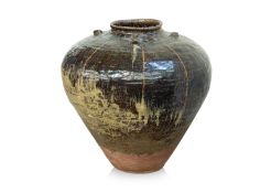 A LARGE BROWN GLAZED MARTABAN JAR