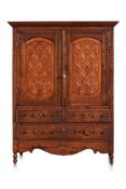 AN ANGLO INDIAN ROSEWOOD AND TEAK CABINET