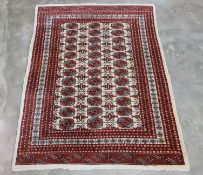 AN AFGHAN BOKHARA TYPE WOOL RUG (176 x 124CM)